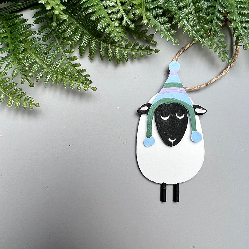 Peerie sheep with a hat decoration