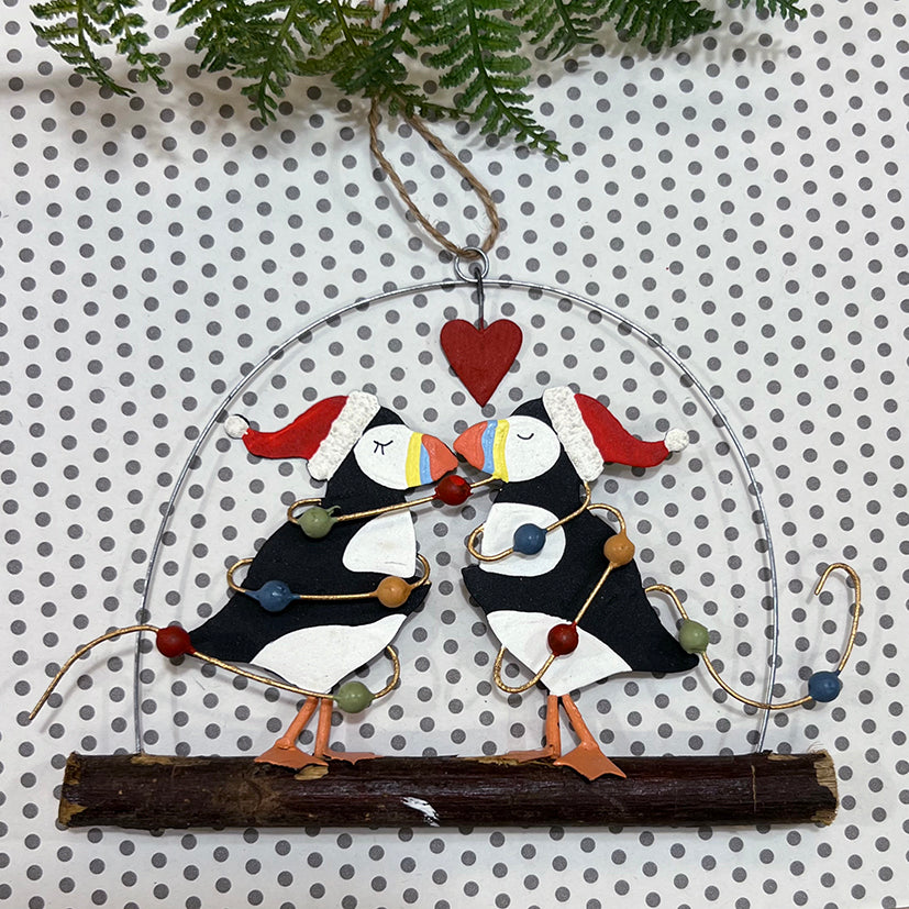 Hanging kissing puffins