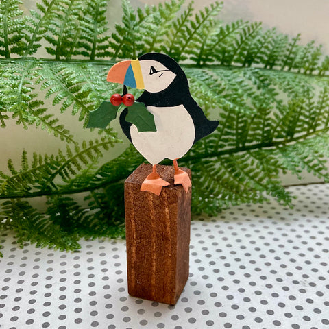 Puffin on a post with holly