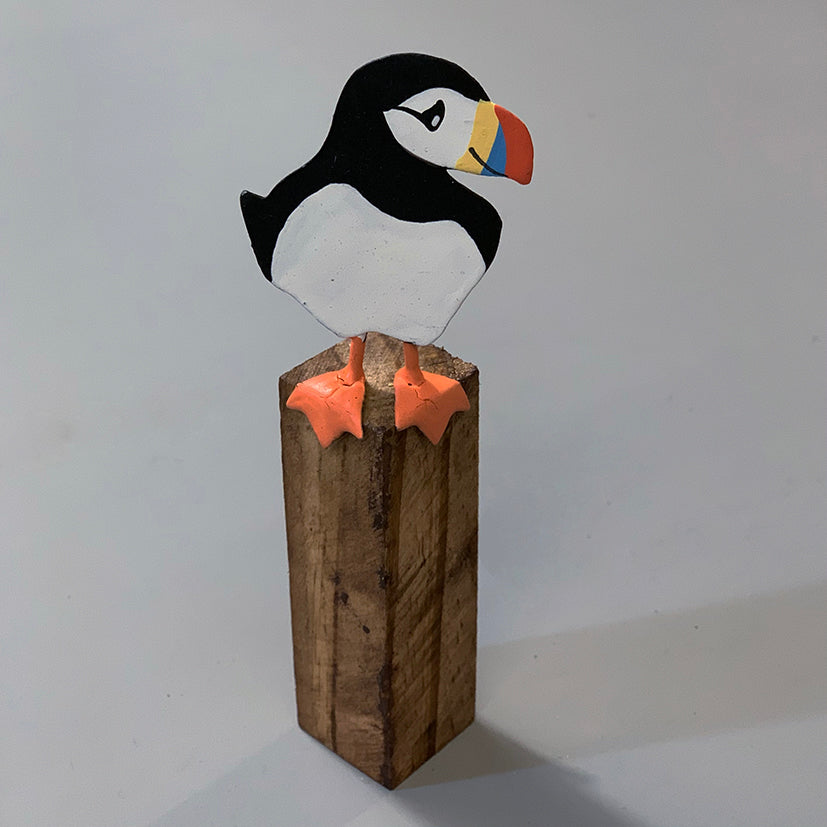 Single puffin on a post